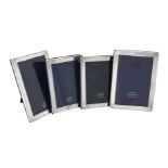 Four silver mounted rectangular photo frames by Kitney & Co.