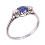 A sapphire and diamond three stone ring