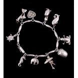 A silver coloured charm bracelet by Henry Pilstrup for Georg Jensen