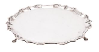 A silver shaped circular salver by Harrods Ltd.