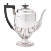 A late Victorian silver half gadrooned coffee pot by Walker & Hall