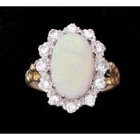 An opal and diamond cluster ring