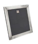 A silver mounted square photo frame