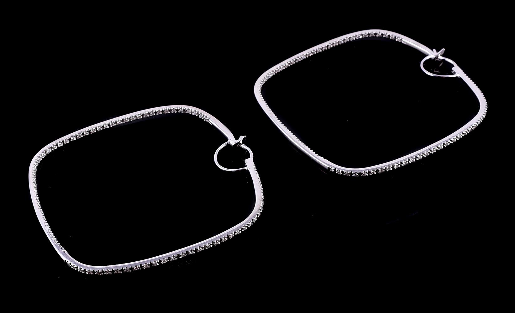 A pair of diamond ear hoops
