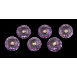 A suite of six Late Victorian amethyst and seed pearl buttons