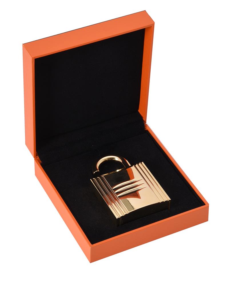 Hermes, a gilt metal padlock perfume holder, 8.5cm high, with a Hermes ...