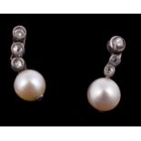 A pair of diamond and pearl ear pendants