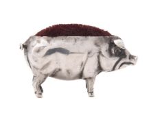 An Edwardian silver novelty pig pin cushion by Sydney & Co.