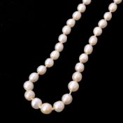 A pearl necklace with a diamond cluster clasp