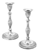 A pair of silver candlesticks by Goldsmiths & Silversmiths Co. Ltd.