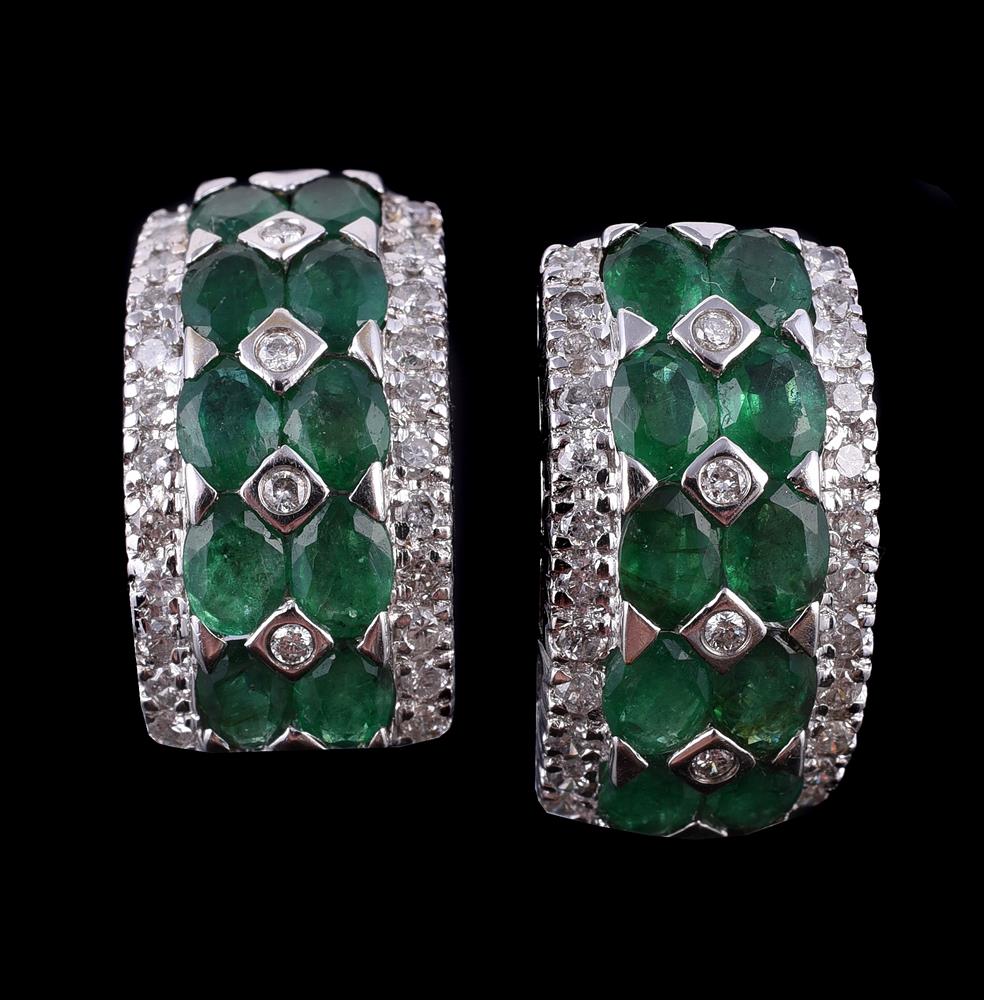 A pair of emerald and diamond earrings