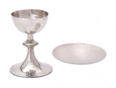 A silver communion cup and paten by Charles Godfrey Langdon