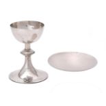 A silver communion cup and paten by Charles Godfrey Langdon