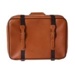 Louis Vuitton, a tan leather suitcase