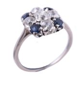 A sapphire and diamond cross cluster ring