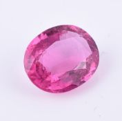 † An unmounted oval cut rubellite