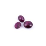 † Three oval cabochon rubies