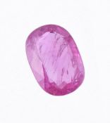 † An unmounted oval cut pink sapphire