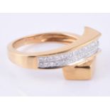 An 18 carat gold diamond crossover dress ring