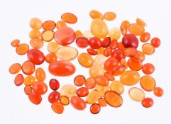† A packet of oval cabochon fire opals