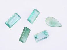 † Five unmounted emeralds