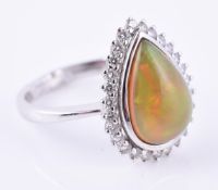 An opal and diamond cluster ring