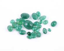 † A packet of unmounted oval cabochon emeralds