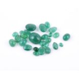 † A packet of unmounted oval cabochon emeralds