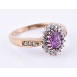 A 9 carat gold pink sapphire and diamond ring