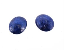† Two unmounted oval cabochon sapphires