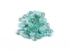 † A packet of oval cabochon emeralds