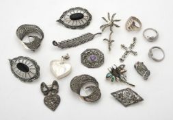 A collection of silver coloured marcasite brooches