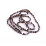 † A parcel of brown diamond beads