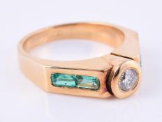 An 18 carat gold, diamond and emerald band ring