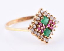 A diamond, ruby and emerald cluster dress ring