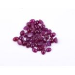 † A parcel of oval cabochon rubies