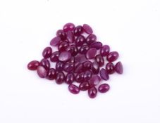 † A parcel of oval cabochon rubies