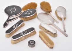 Y A silver mounted and tortoiseshell five piece dressing table set by E. S. Barnsley & Co.