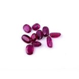 † A packet of unmounted oval cut rubies