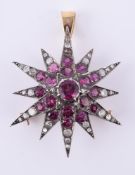 An garnet and diamond star brooch/pendant