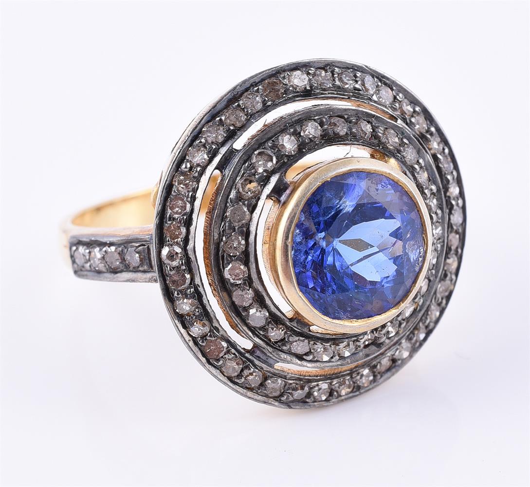 A tanzanite and diamond cluster dress ring