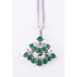 An emerald and diamond pendant