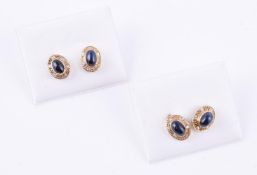 Two pairs of cabochon sapphire ear studs