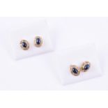 Two pairs of cabochon sapphire ear studs