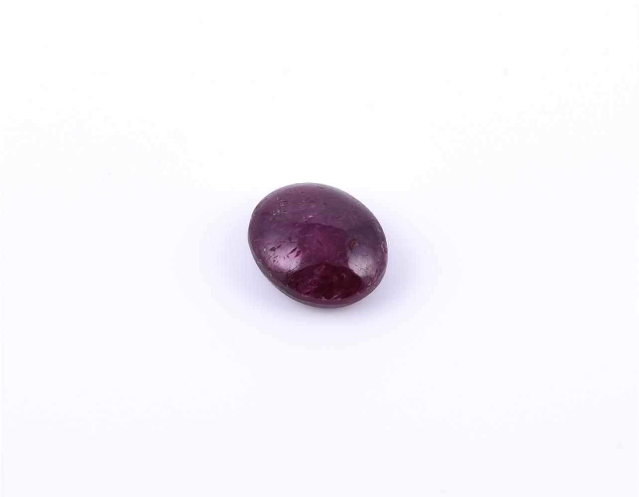 † An oval cabochon ruby