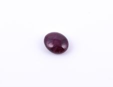 † An oval cabochon ruby