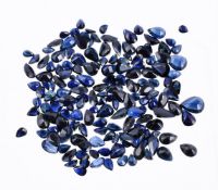 † A packet of unmounted pear cut sapphires