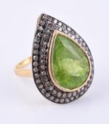 A diamond and peridot cluster ring