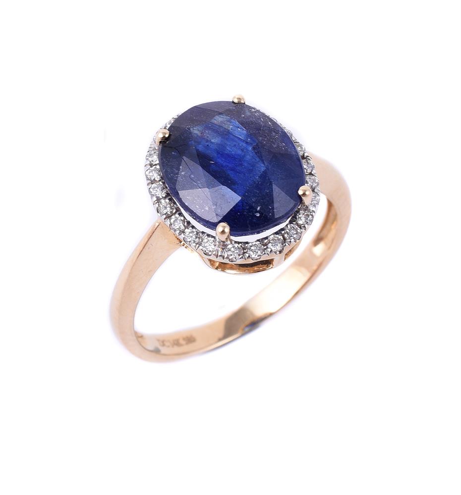 A diamond and synthetic sapphire dress ring