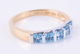 A blue topaz five stone ring